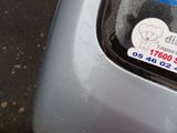 a sticker on the back of a car with a sticker on it