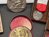 many medals and medals on display on a table