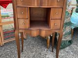 a small wooden table with a shelf on top of it
