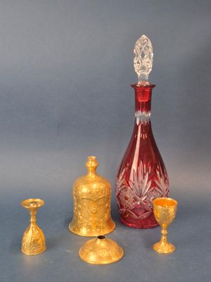 several pieces of glass and gold on a blue background