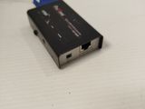 a black and silver device on a white surface