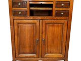 an image of a wooden cabinet with drawers and drawers