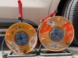 two cables connected to the front wheels of a car