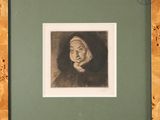 portrait of an old woman in a wood frame with a green mat