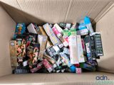 a cardboard box filled with assorted items for sale