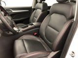 the interior of a car with black leather seats and red stitching