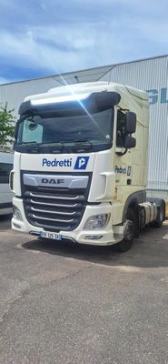 a white truck that is parked in front of a building
