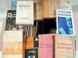 a lot of books that are stacked on top of each other