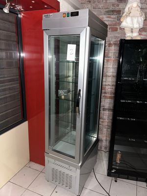 an image of a refrigerator in a room with a brick wall