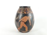 a vase with a painting of a man on it