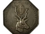 une image représentant une pièce d'argent sur laquelle figure une tête de cerf