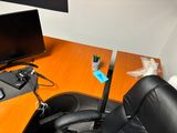 a desk with a chair and a monitor on it