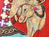 an image of a close up of a red jacket with a horse on it