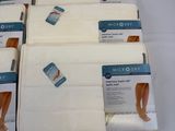 six packs of microsoft underwear are on a white table