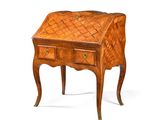 an image of a small wooden desk with drawers