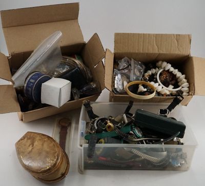 two boxes of assorted items sitting on a table
