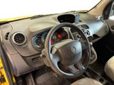 dashboard of a small car with a steering wheel and dashboard controls