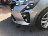 a close up of the front bumper of a silver car