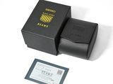 a black box that has a card and a wallet in it