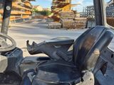a close up view of a forklift with a steering