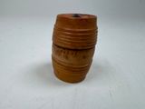 a small wooden barrel that is sitting on a table