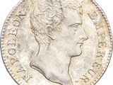 a close up of a coin with a woman ' s head on it