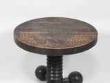 a close up of a wooden table with metal legs and a wooden top
