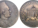 an image of a coin with a picture of a man and a dog on it