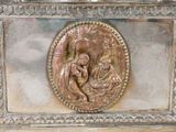 a silver box with a picture of a manger on it