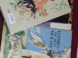 de nombreux livres pour enfants sur la table