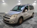 the silver van is parked on a checkered floor in a room