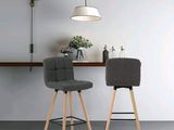 two chairs that are next to each other in a room