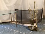 a glass table with a metal stand and a glass table with a glass top