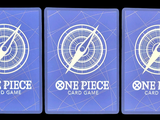 three blue playing cards with one piece and one piece on them