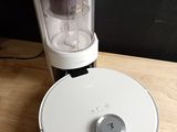 a small blender sitting on a table next to a coffee maker