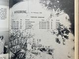 an open book with a picture of a city on it