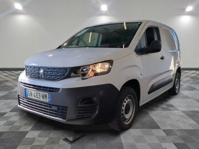 the white van is parked on a checkered floor in a garage