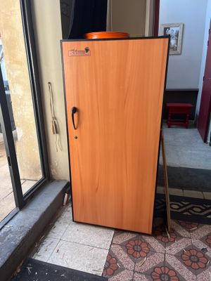 a refrigerator that is sitting in front of a window