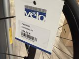 a bicycle tire with a tag on it in a store