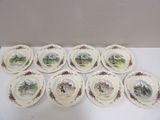six assiettes ornées d'une illustration représentant une scène de vie à la ferme, posées sur une table