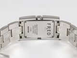 a watch that is on a bracelet on a white surface