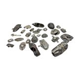 a pile of metal objects that are on a white surface