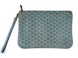a close up of a small blue purse with a zipper