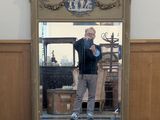 a man taking a picture of himself in a mirror