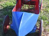 a small toy car that is sitting in the grass