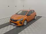 the orange car is parked in the garage on the checkered floor