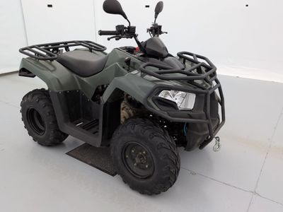 an image of a four wheeler atv in a garage