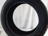 a close up of a tire on a white surface with a white background