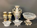 many different types of vases and bowls on the table