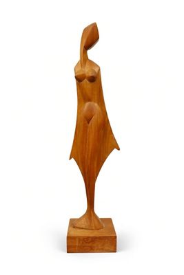 a wooden sculpture of a woman with a hat on her head